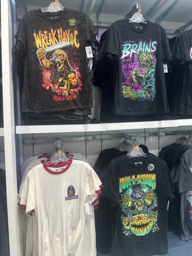 Howl-O-Scream shirts with Wreak Havoc, Looking for Brains, pumpkin artwork, and a white ringer design.